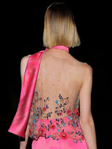 a woman in a pink dress holding a pink surfboard