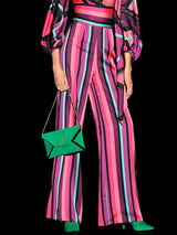 a woman in a pink dress holding a kite
