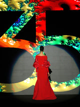 Vestido de fiesta realizado en crepe color geranio con cuerpo escote liz drapeado y maxi mangas en organza, falda de capa con abertura de Hannibal Laguna