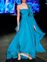 LOOK 24 Vestido MURANA | Vestido de fiesta en gasa azul petróleo con escote palabra de honor y falda de gran caída, bajo vivo oro