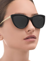 a woman wearing sunglasses is wearing sunglasses 