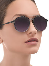 a woman wearing sunglasses and a glasses and sunglasses 