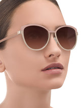 a woman wearing sunglasses and a sunglasses and a sunglasses 